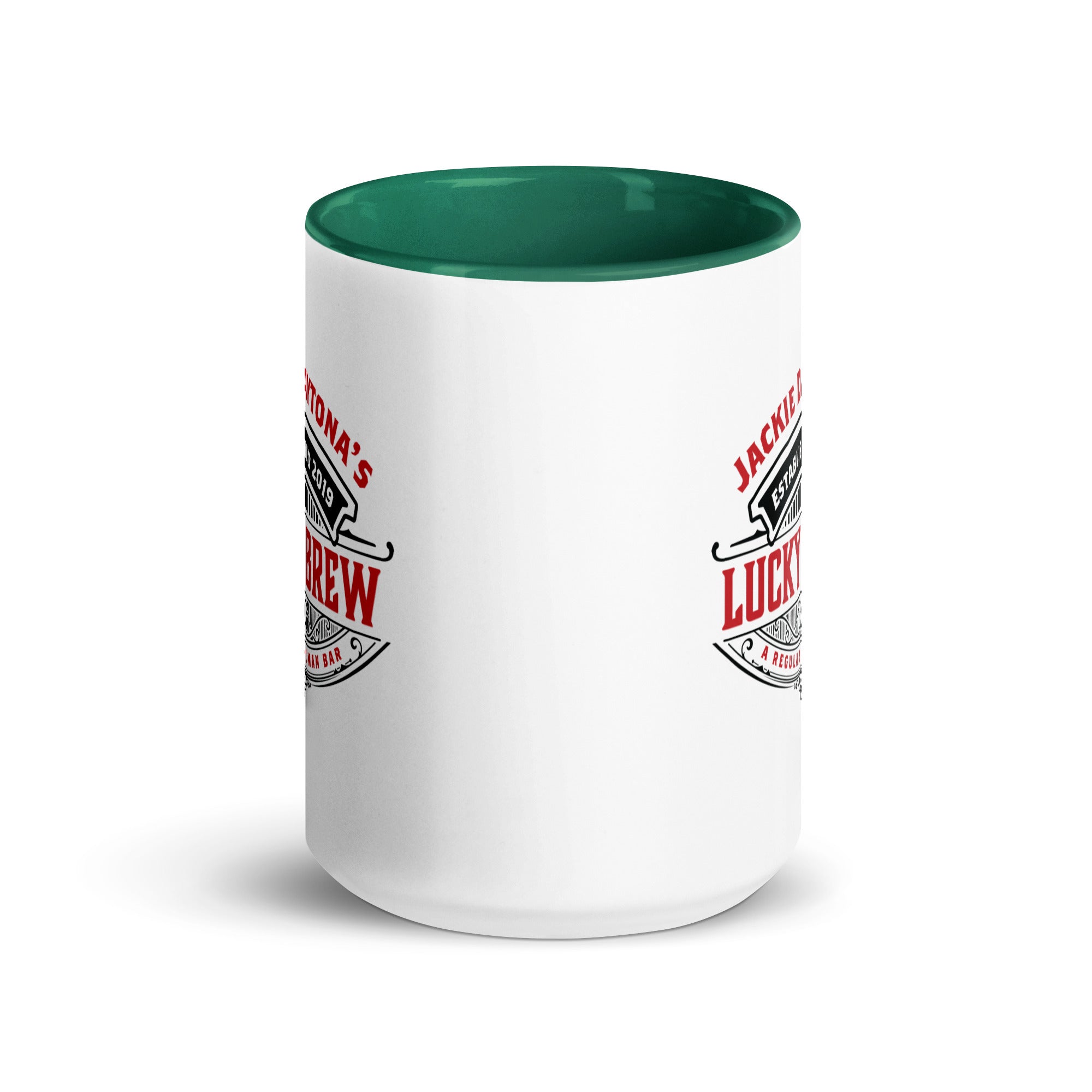 a white coffee mug with a green rim