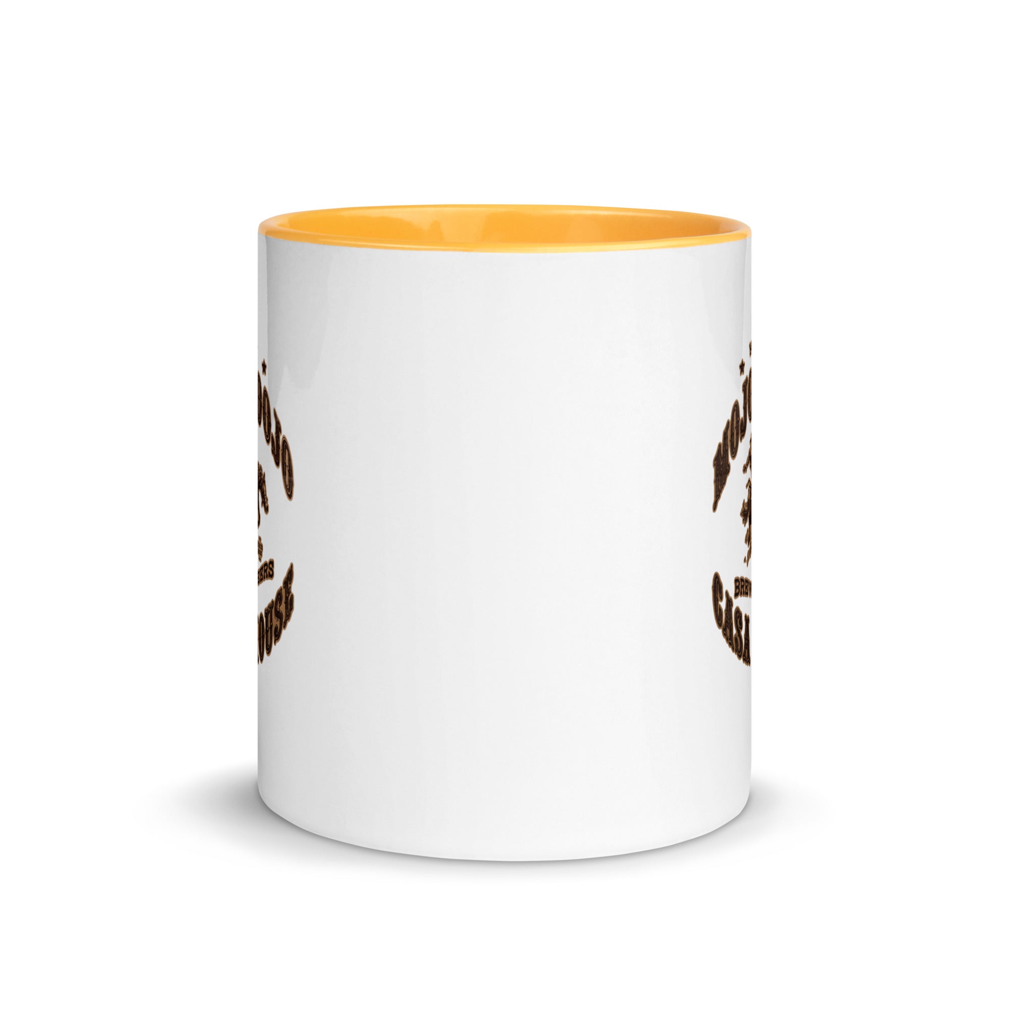a white and yellow coffee mug with a design on it