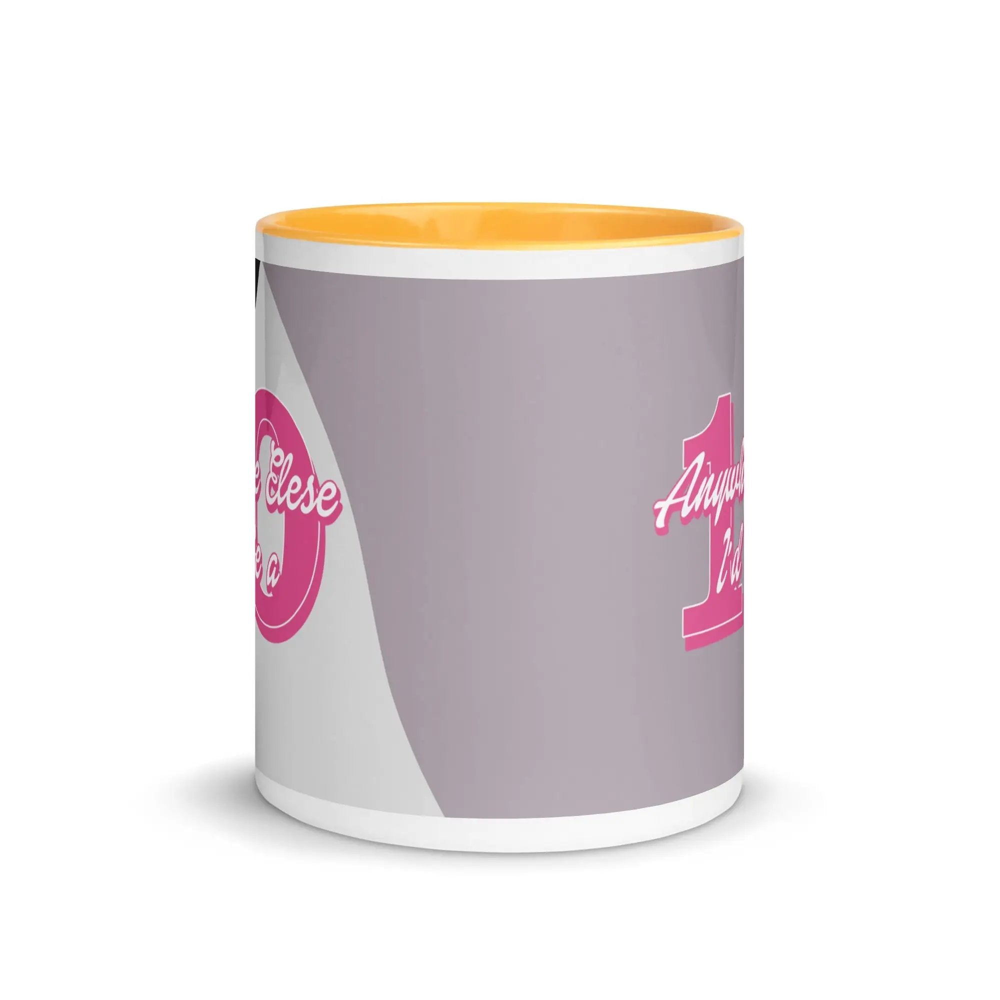 a white and yellow coffee mug with a pink handle