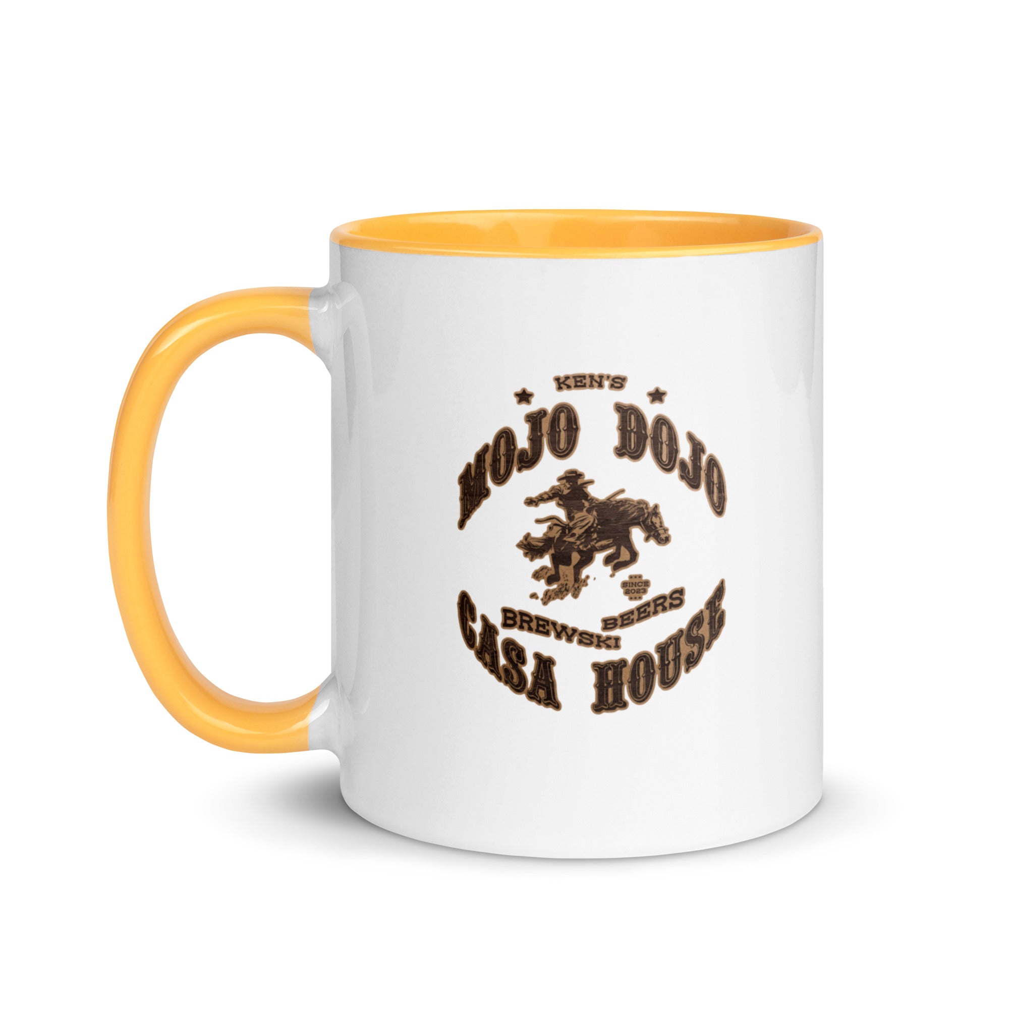 a white and yellow coffee mug with a brown logo