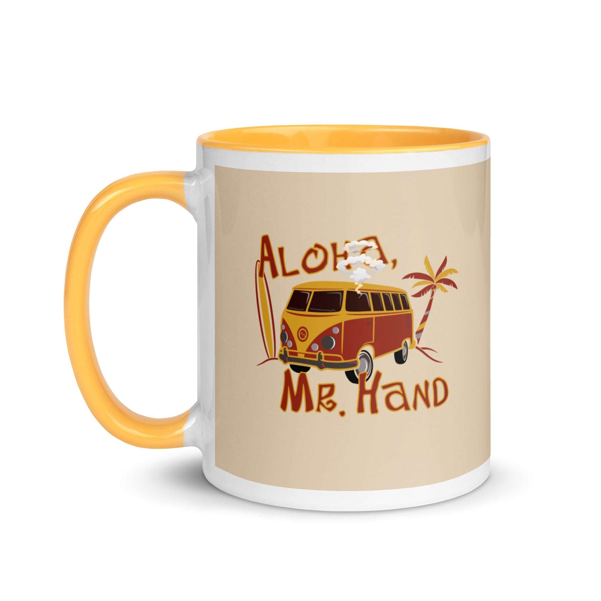 a yellow and white coffee mug with an orange handle