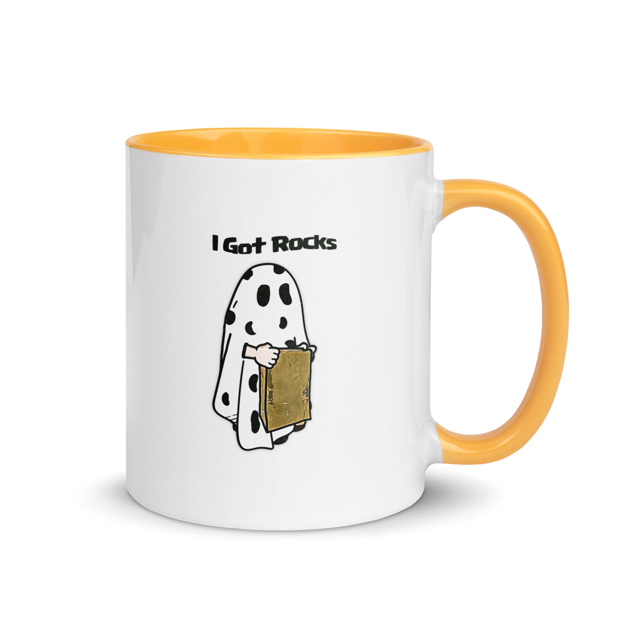 a white and yellow coffee mug with a cartoon of a ghost reading a book