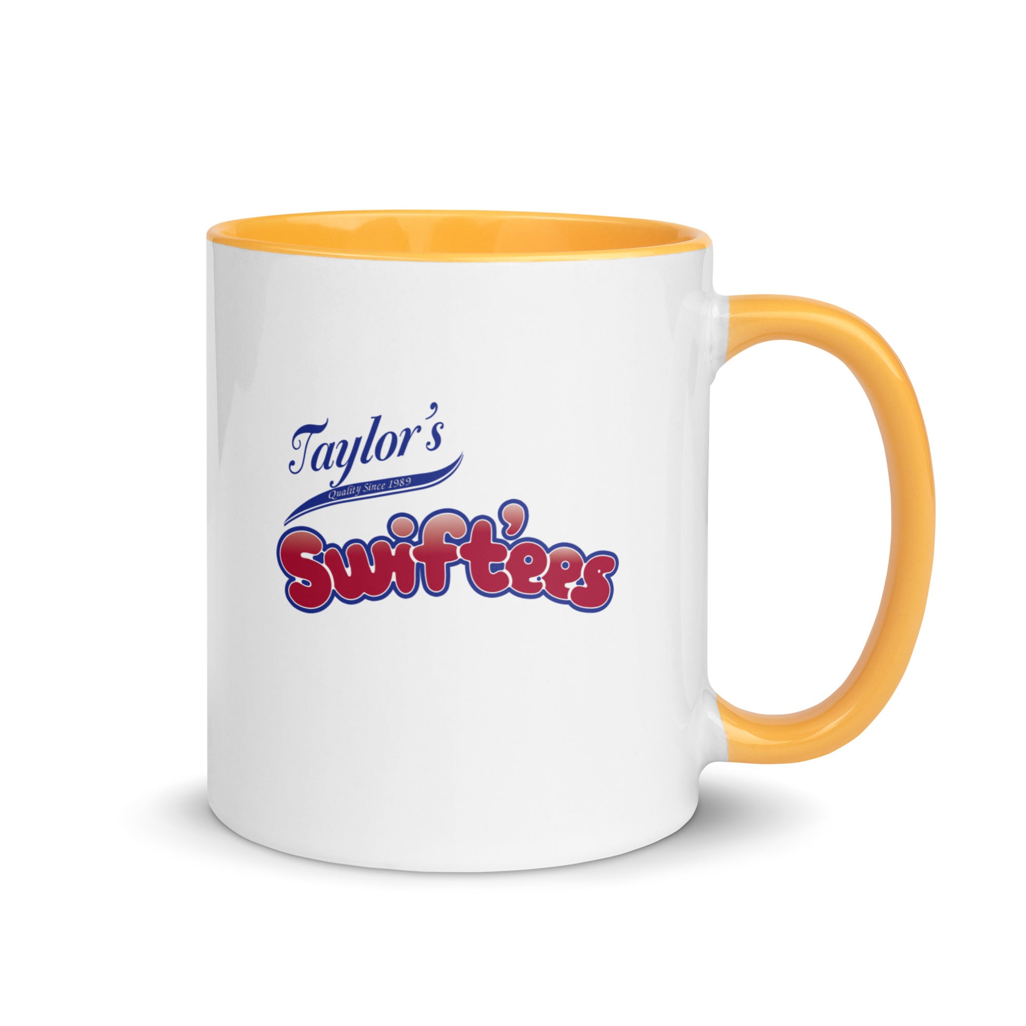a white and yellow coffee mug with taylor's swiftfeasts on it