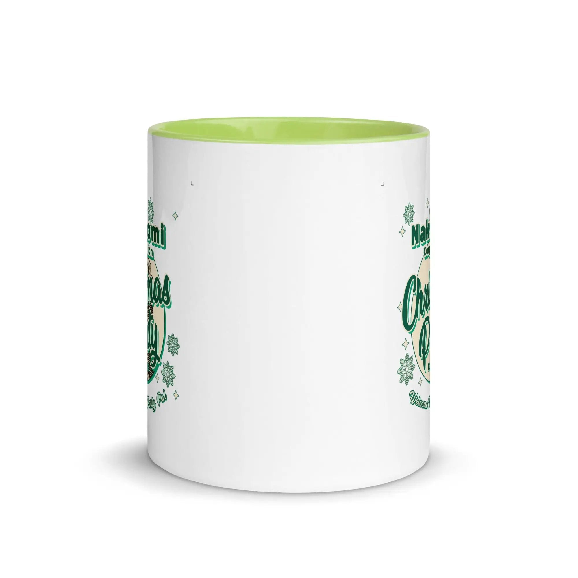 a green and white coffee mug with shamrocks on it