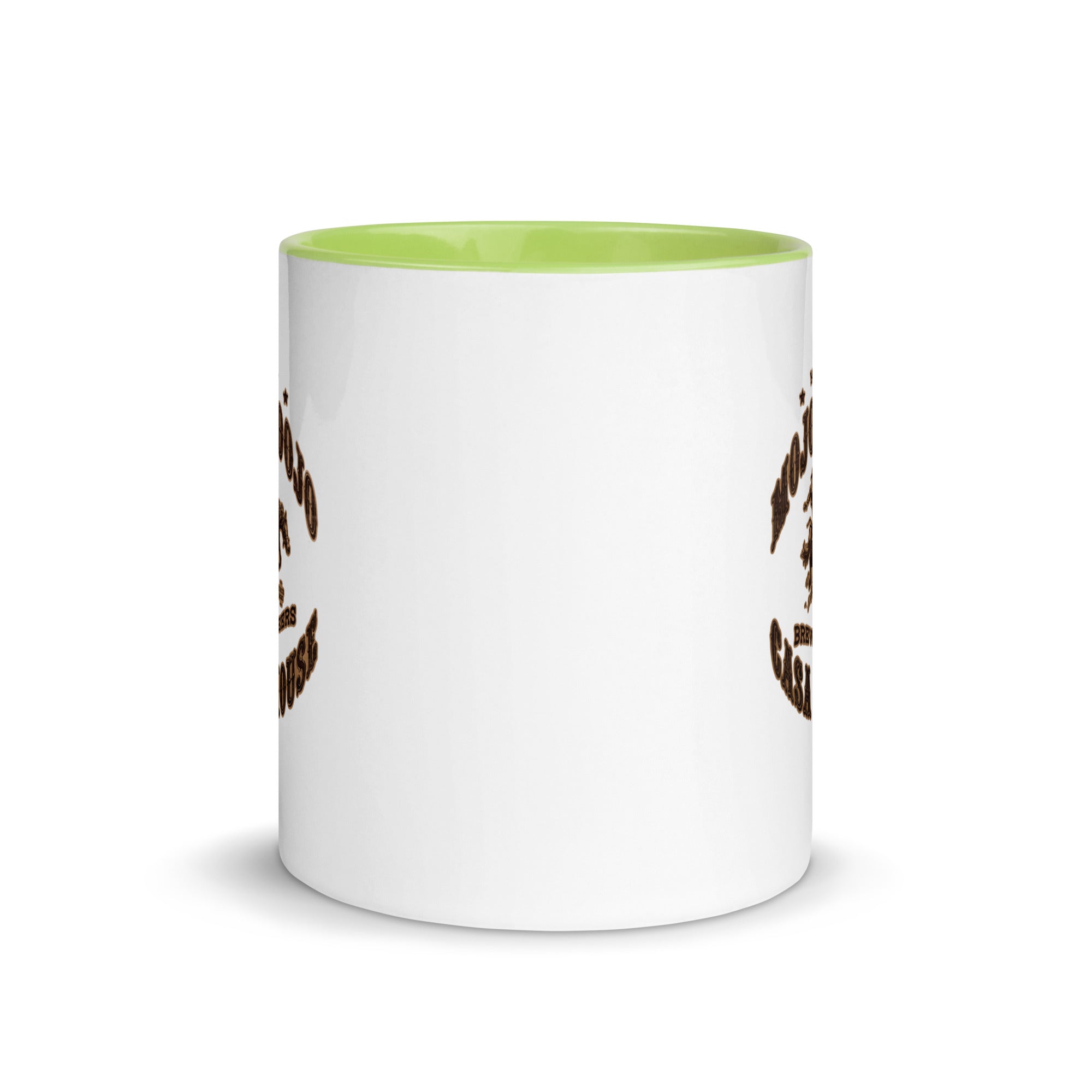 a white and green coffee mug with a design on it