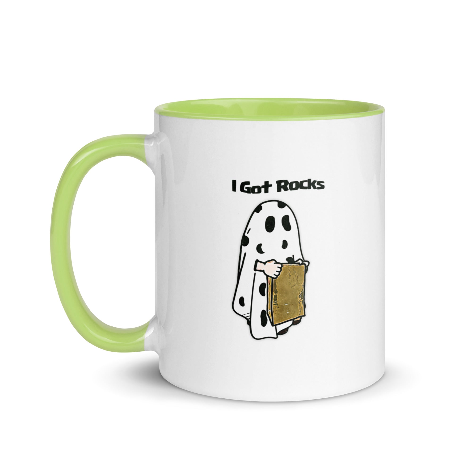 a white and green coffee mug with a cartoon of a ghost holding a piece of