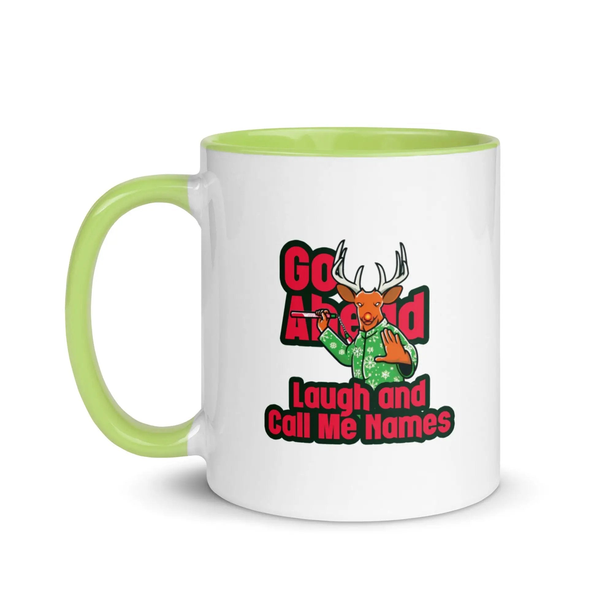 a green and white coffee mug with a picture of a deer