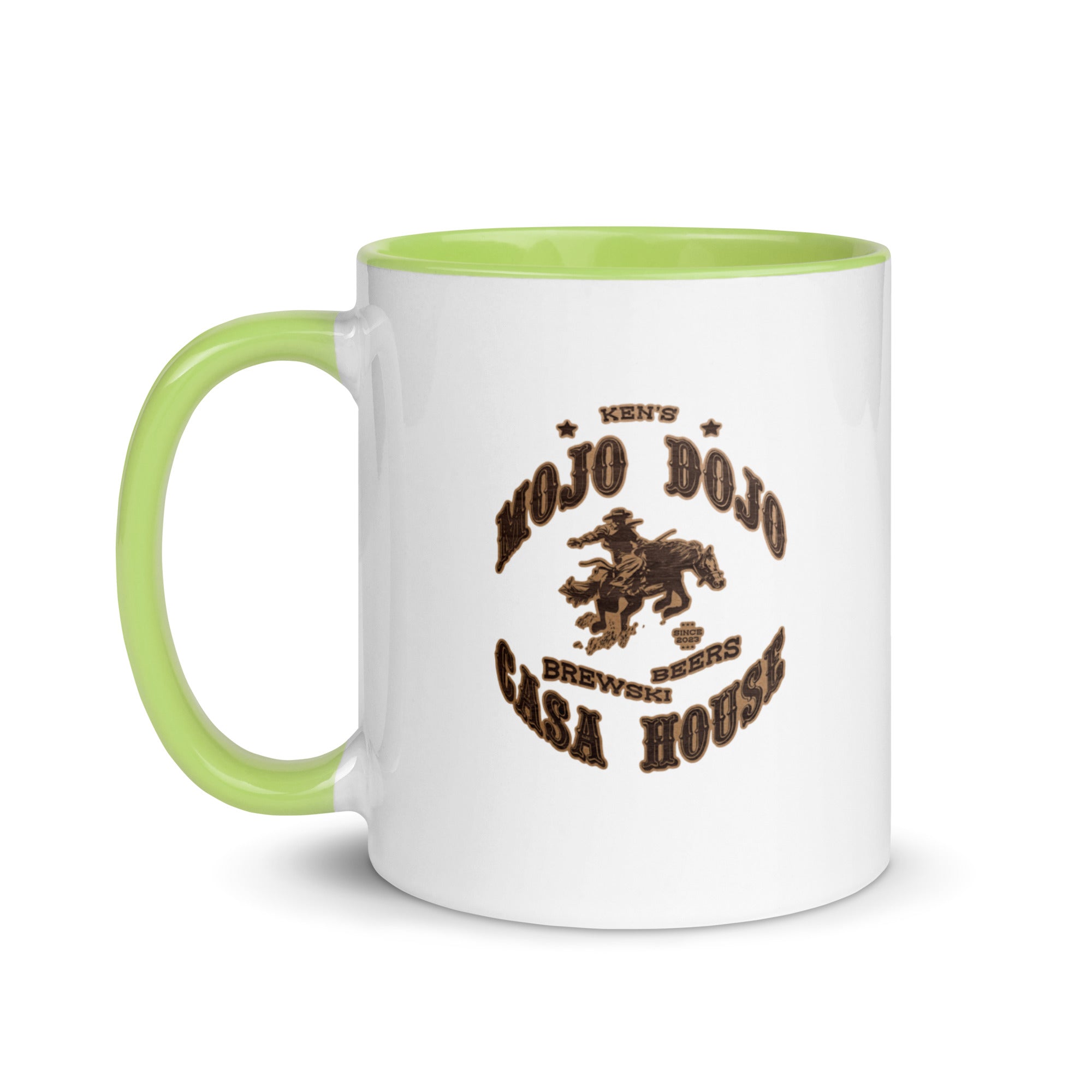 a white and green coffee mug with the words old dog saloon on it