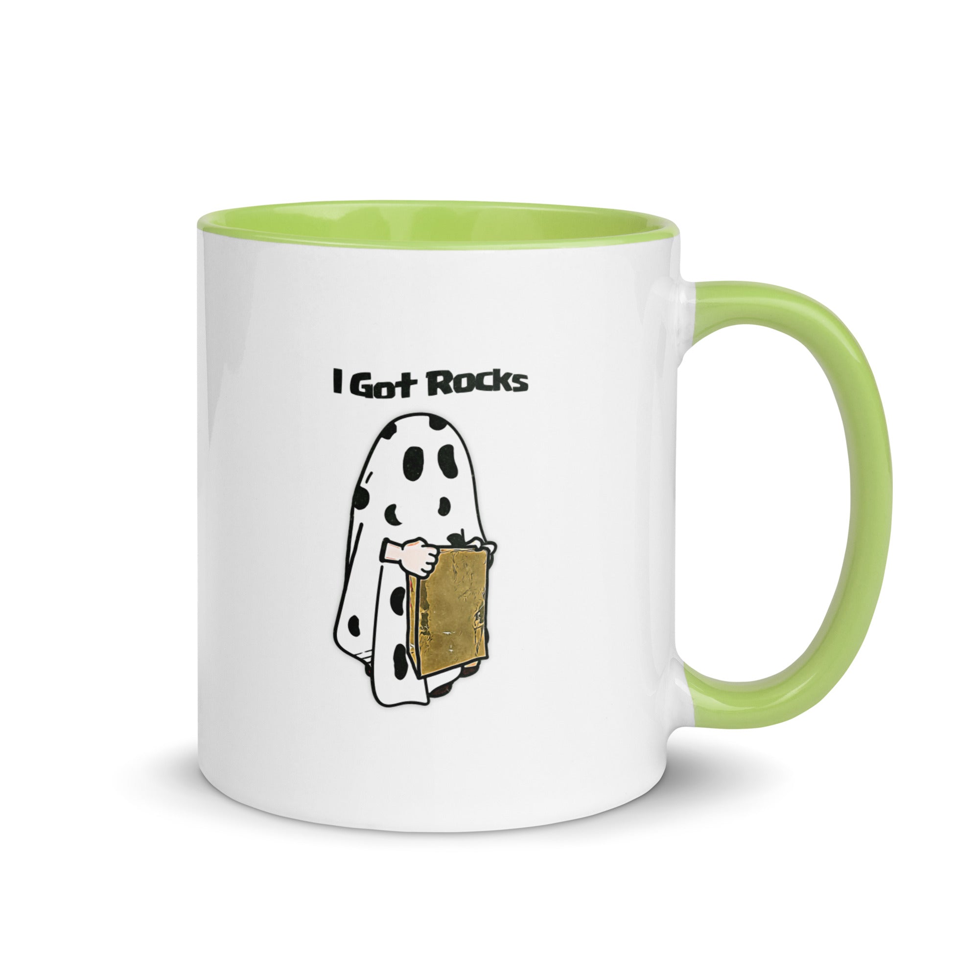 a white and green coffee mug with a cartoon of a ghost reading a book