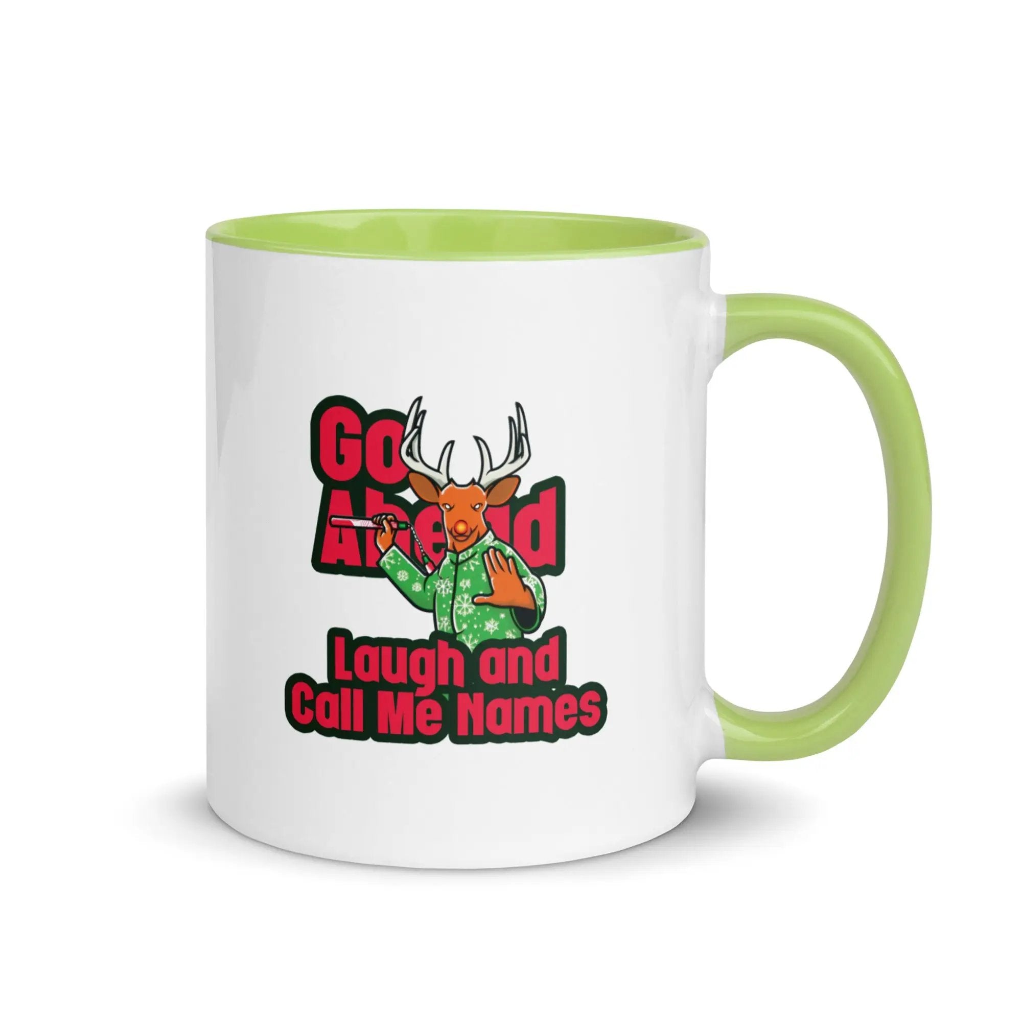 a green and white coffee mug with a picture of a deer