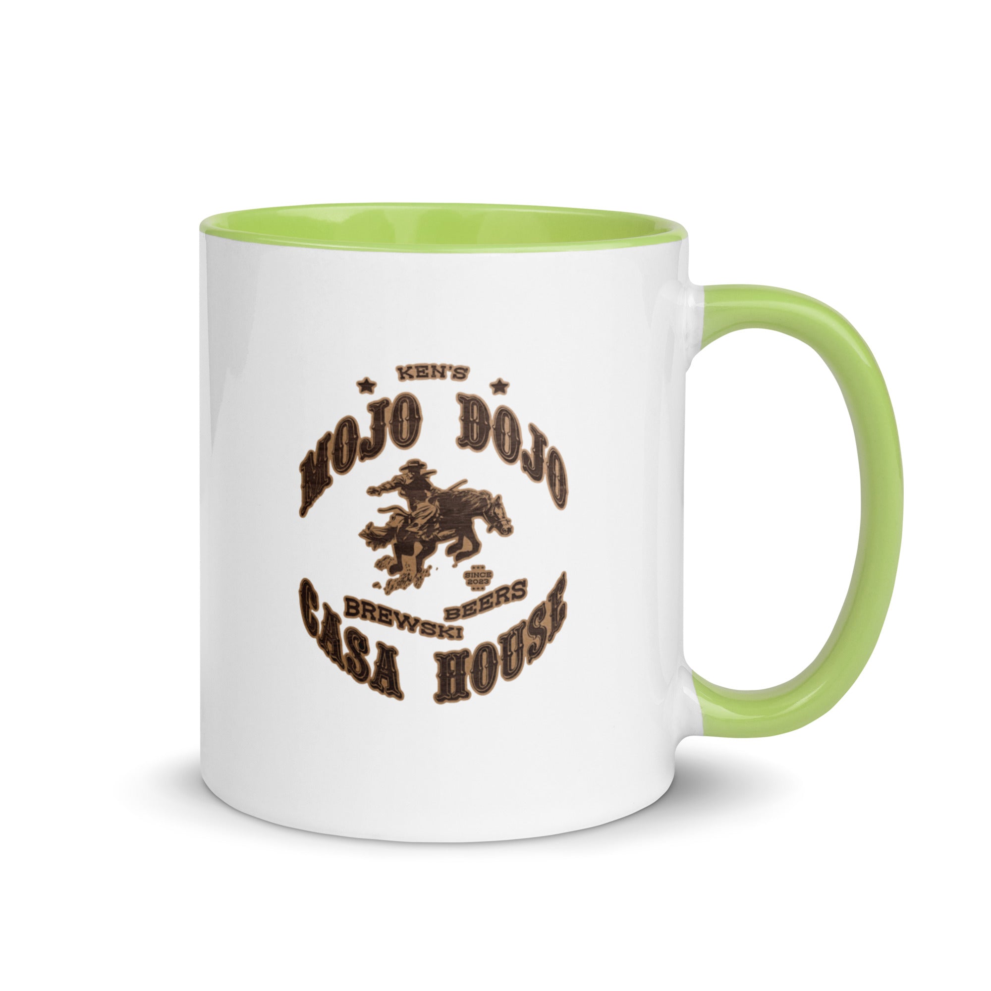 a white and green coffee mug with a horse on it