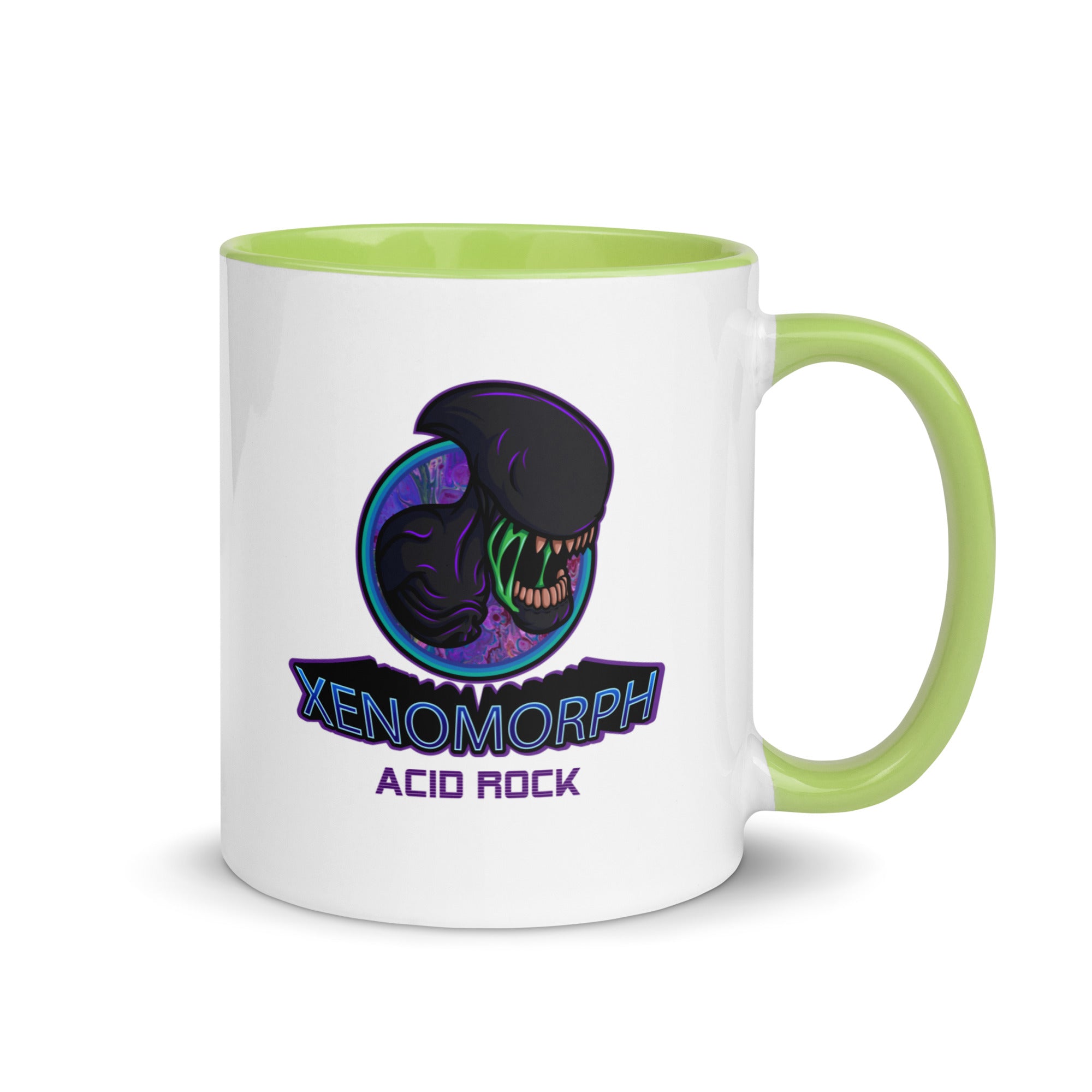 a green and white coffee mug with an image of a dinosaur