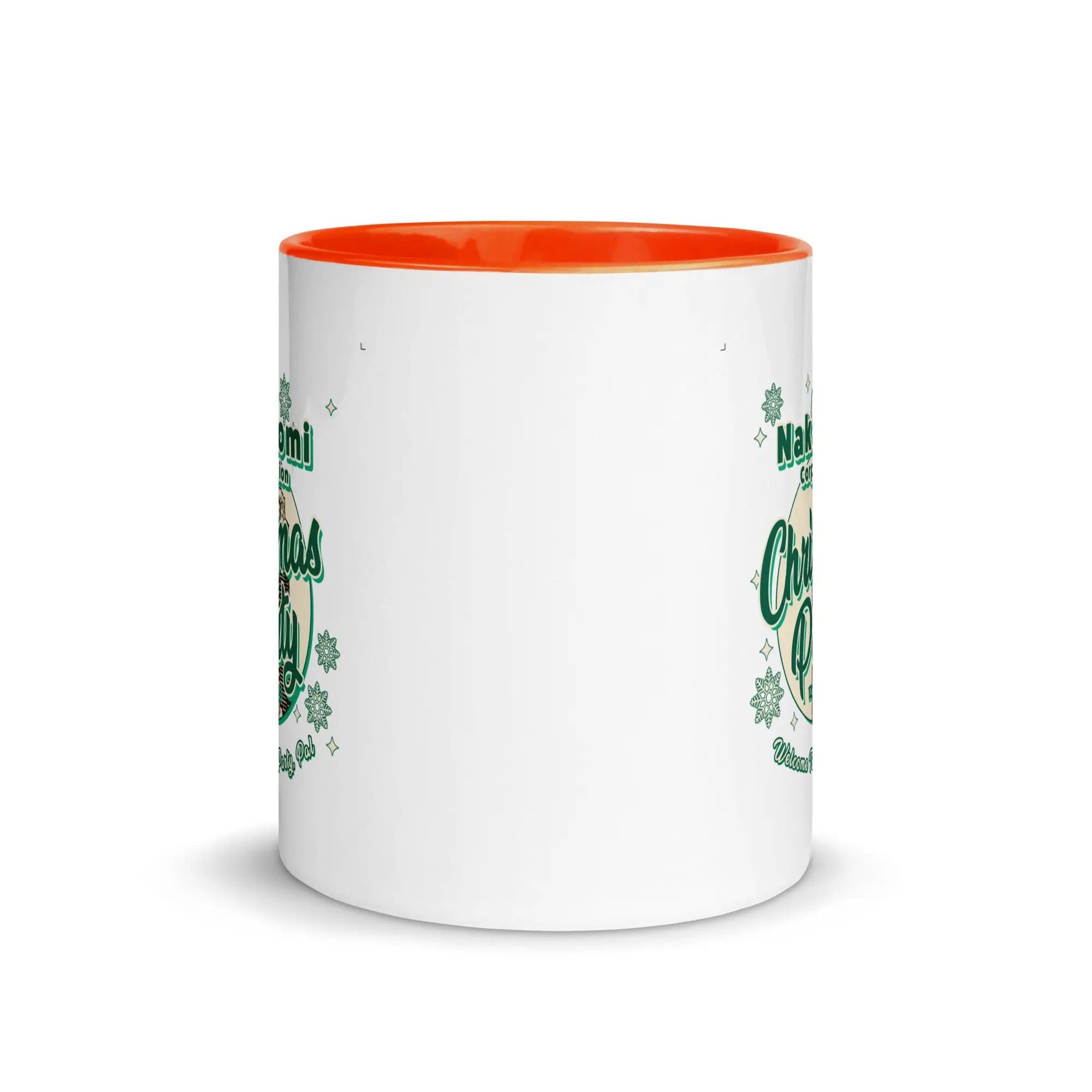 a white and orange coffee mug with shamrocks on it