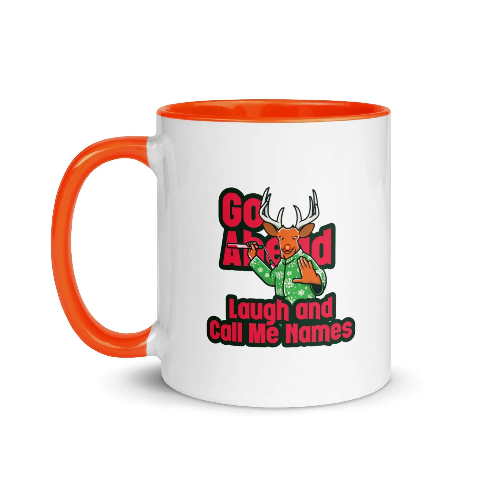 a white and orange coffee mug with an orange handle