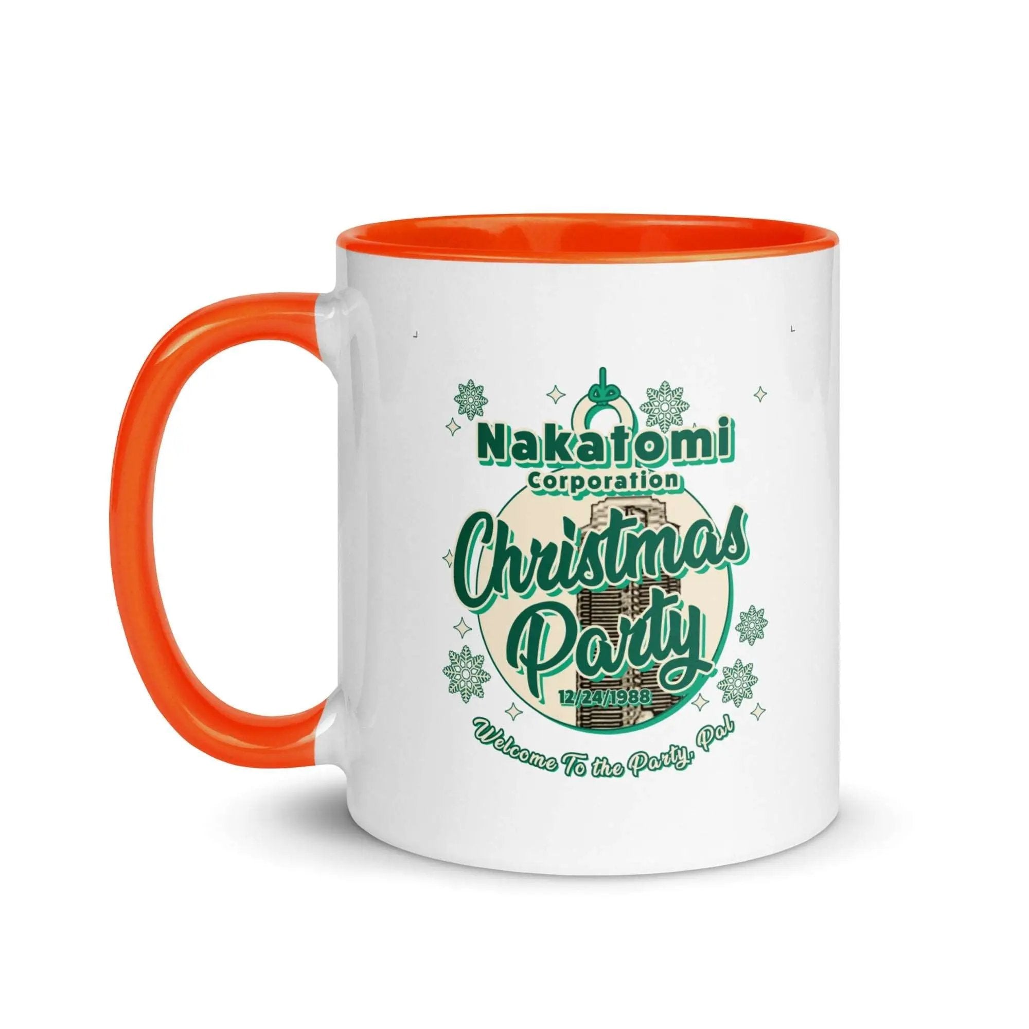 a white and orange coffee mug with an orange handle