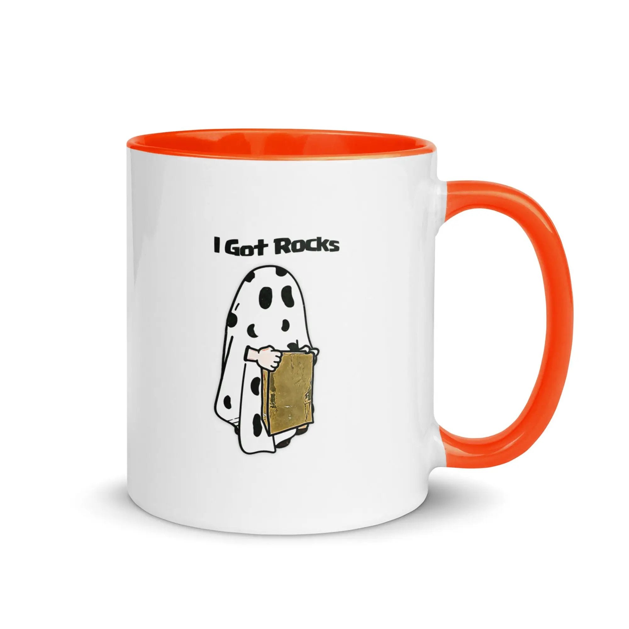 a white and orange coffee mug with a cartoon of a ghost holding a box