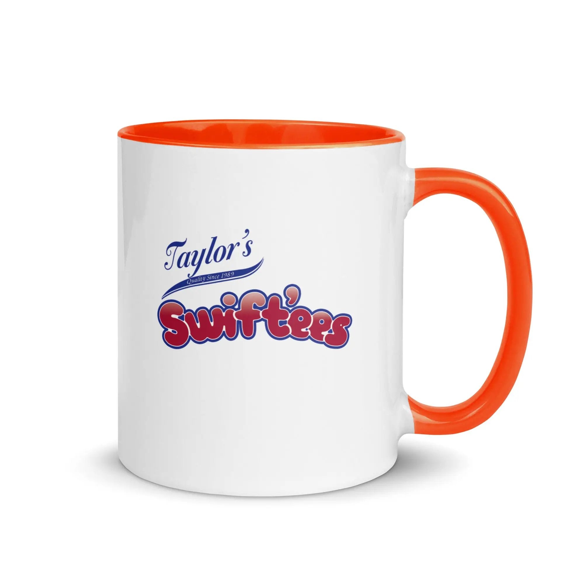 a white and orange coffee mug with taylor's swiftfeasts on it