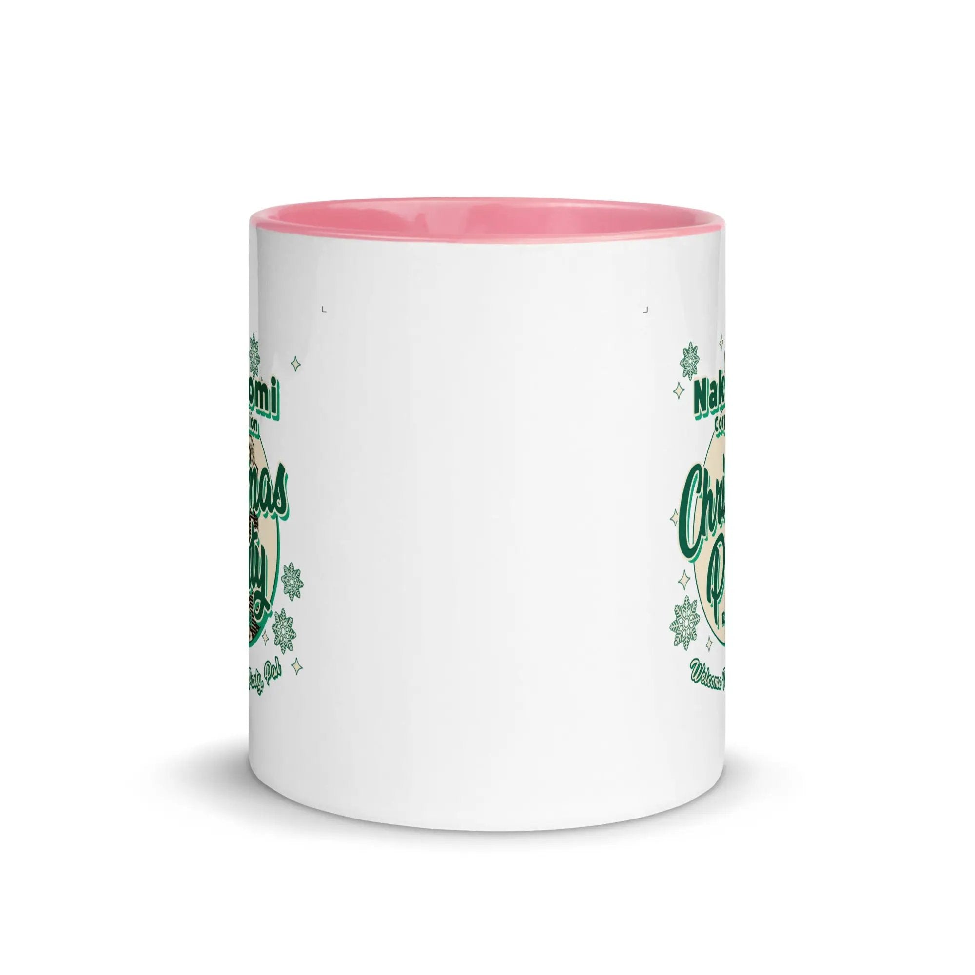 a white and pink coffee mug with shamrocks on it