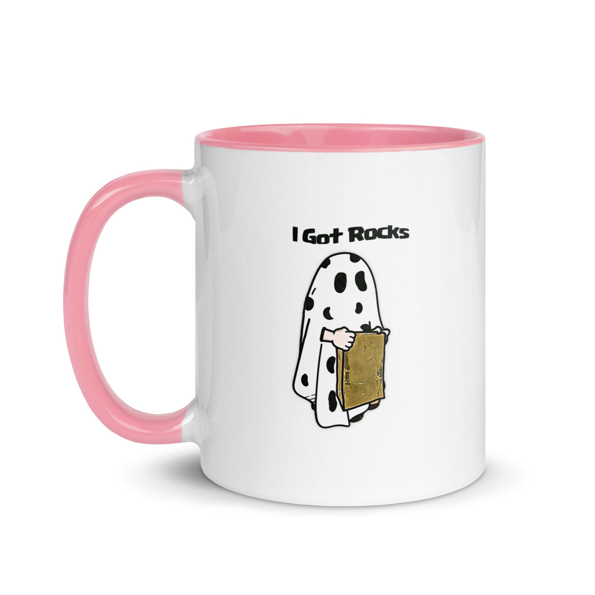a white and pink coffee mug with a cartoon of a ghost holding a piece of