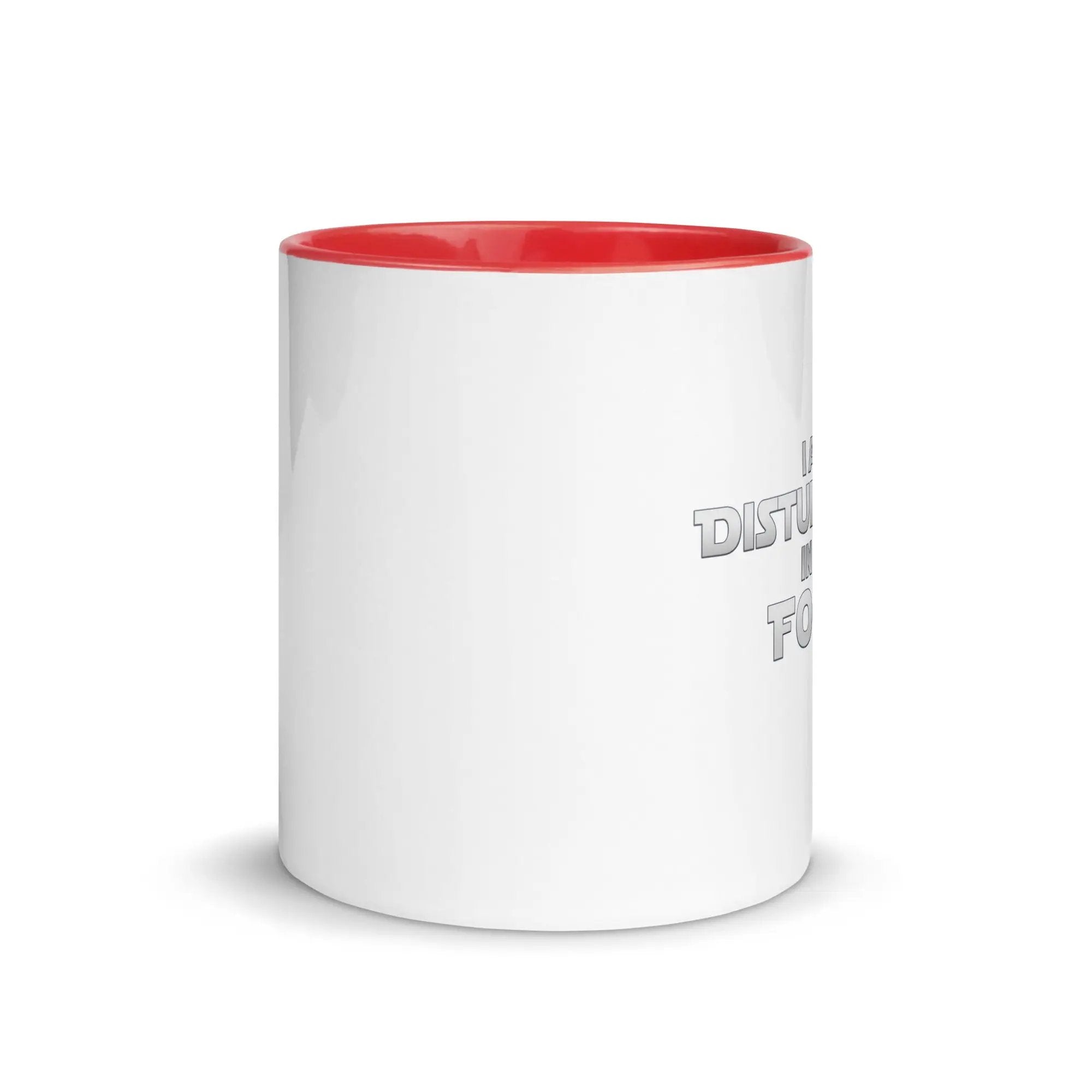 a white and red coffee mug with a red rim