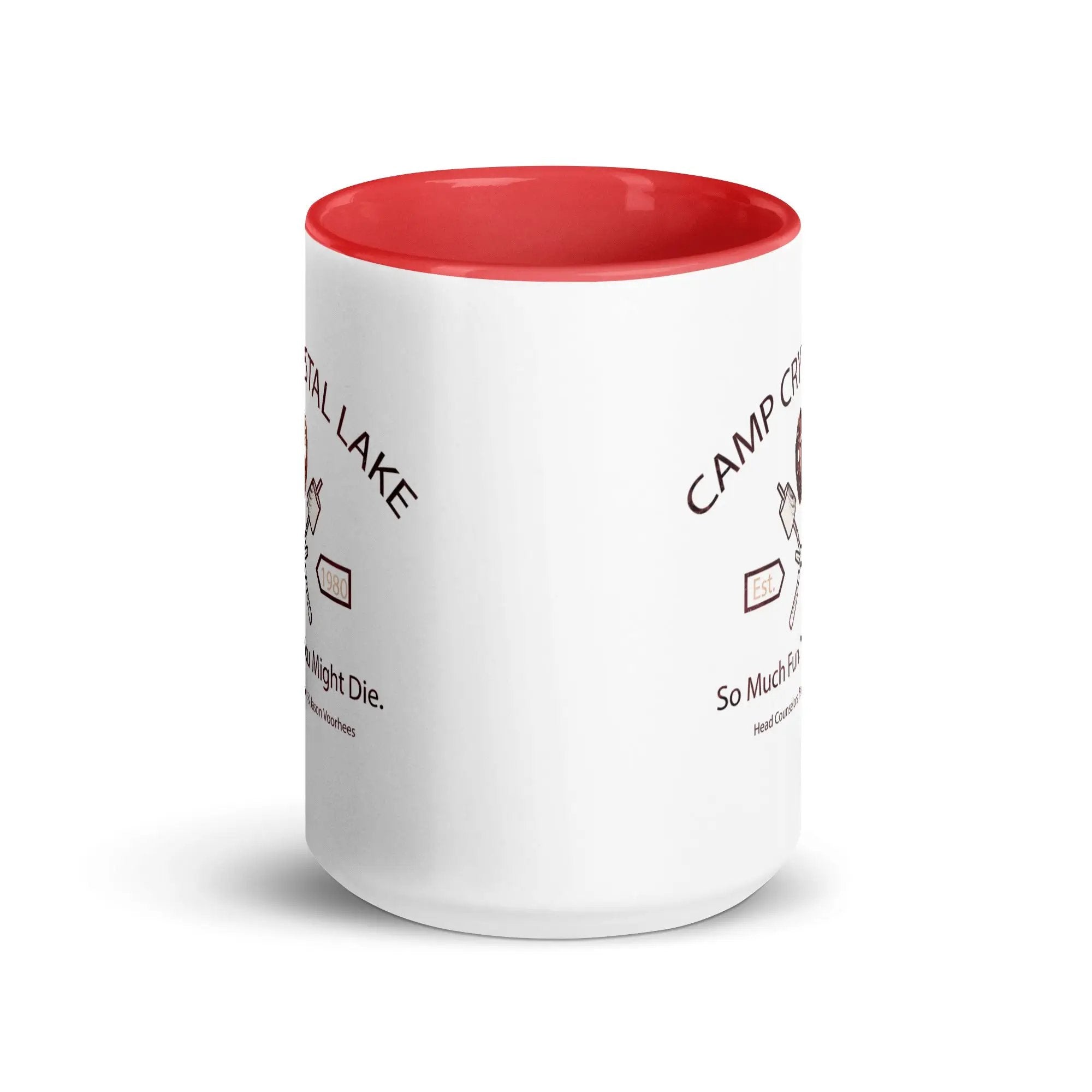 a red and white coffee mug sitting on top of a white table