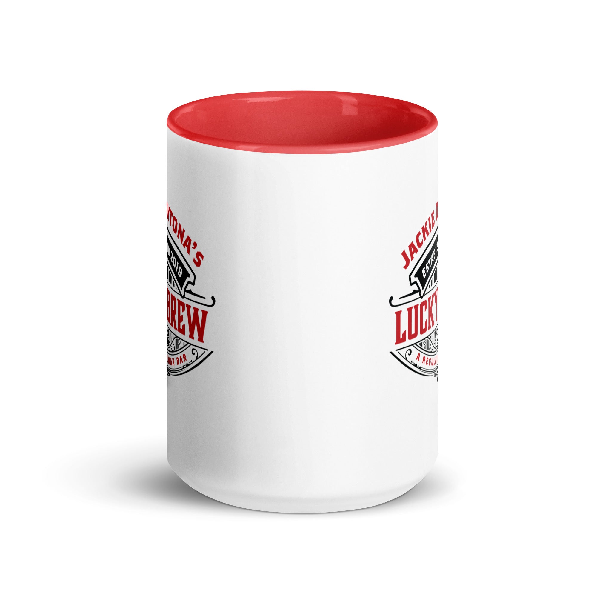 a white and red coffee mug with a red rim