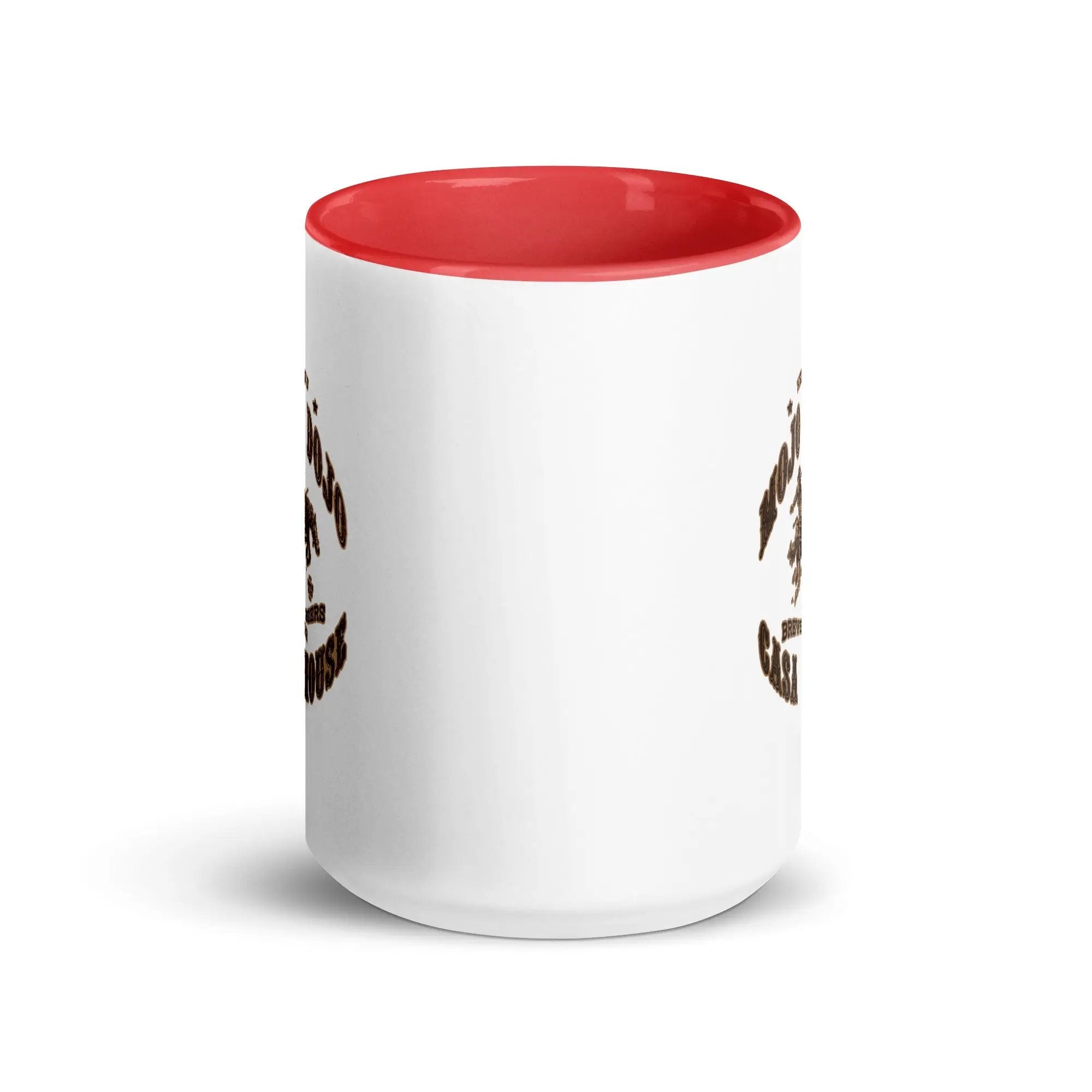a white and red coffee mug with a red rim