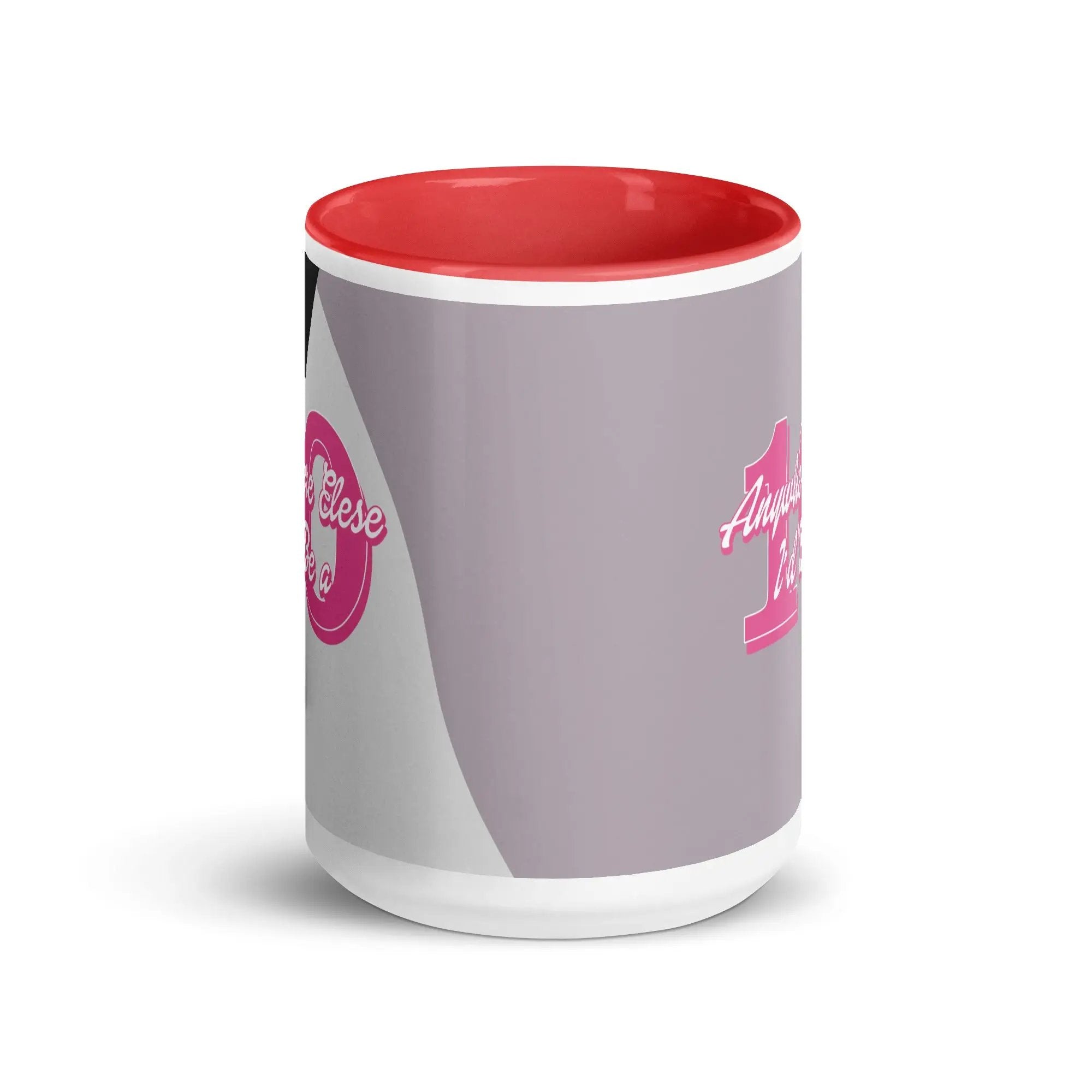 a red and white coffee mug with a pink handle
