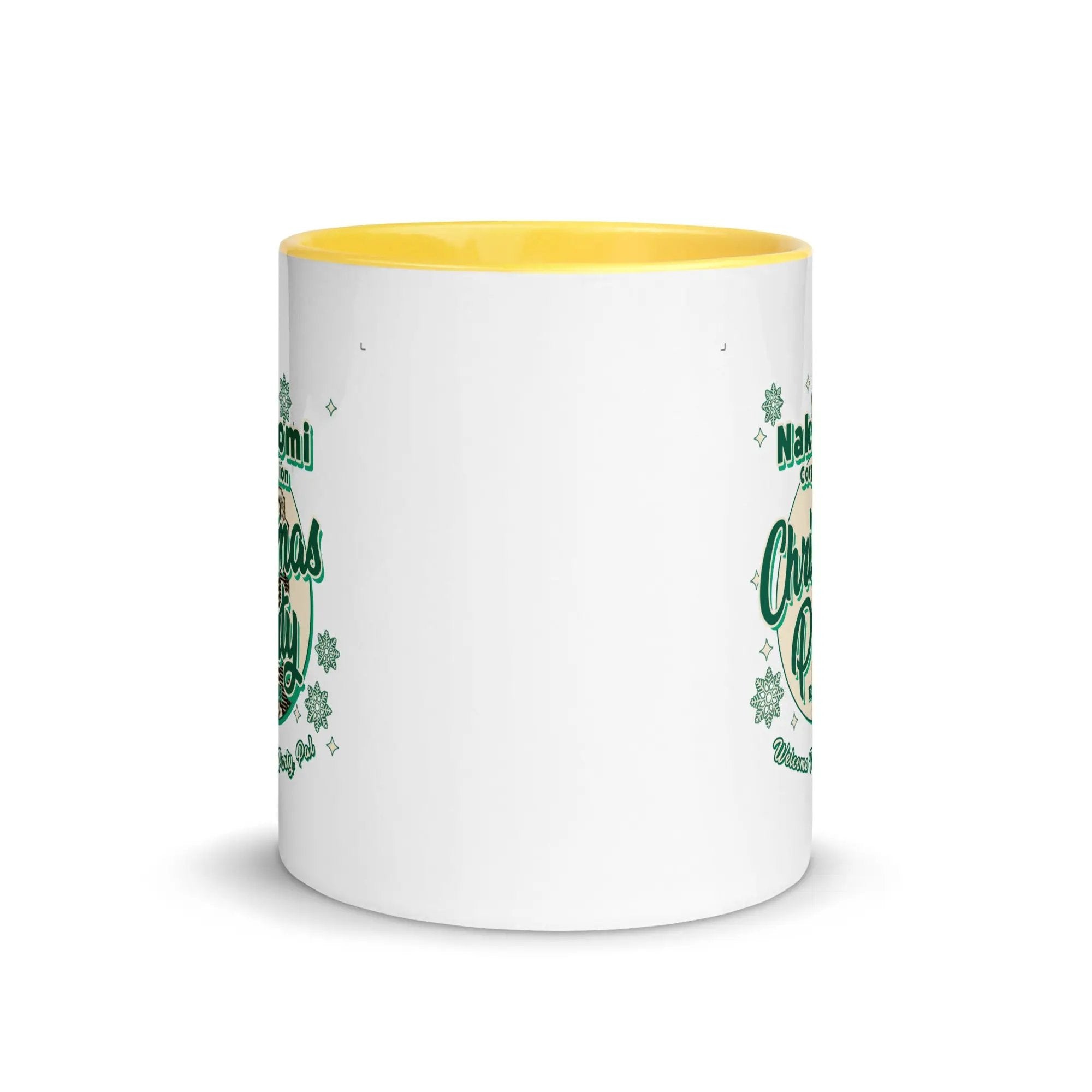 a white and yellow coffee mug with shamrocks on it