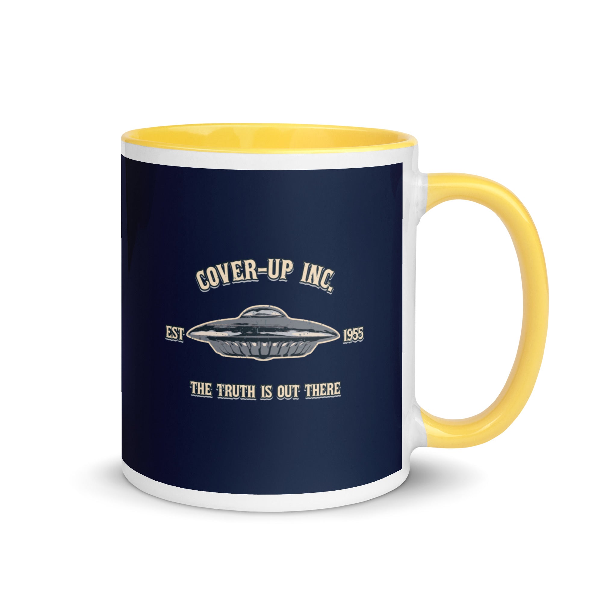 a yellow and white coffee mug with the words cover - up inc on it