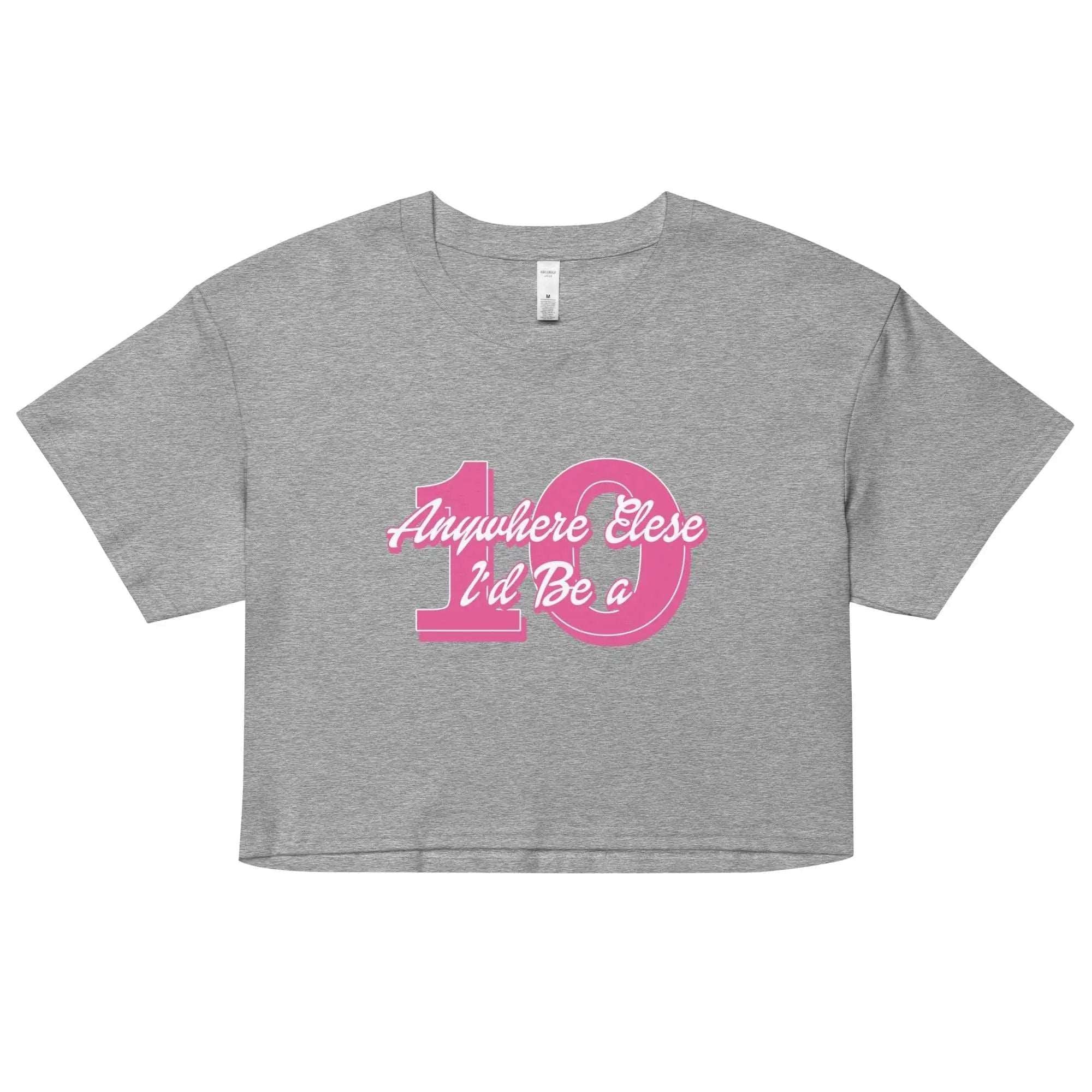 a grey t - shirt with a pink number on the front