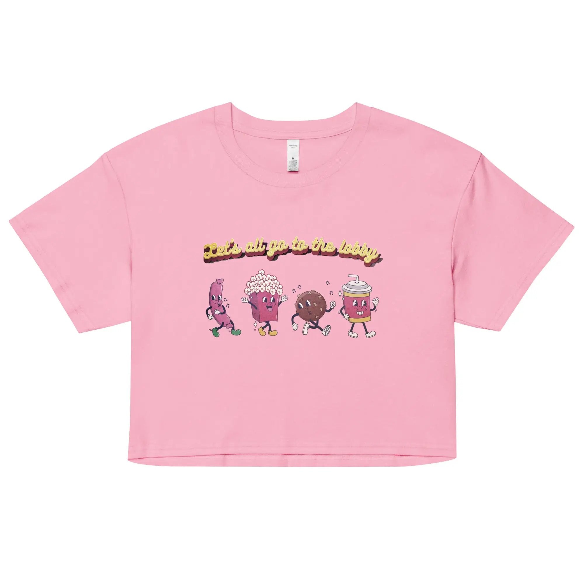 a pink t - shirt with cartoon characters on it
