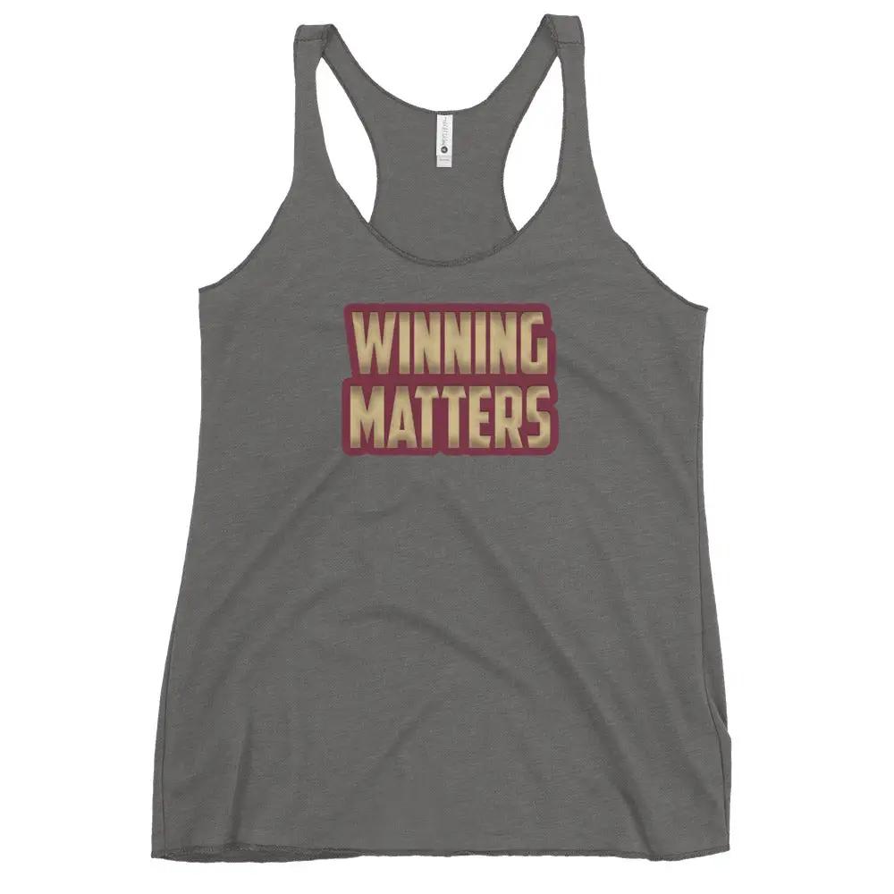 a women's tank top that says winning matters