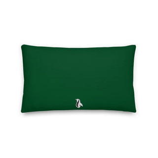 a green rectangular pillow with a white cat on it