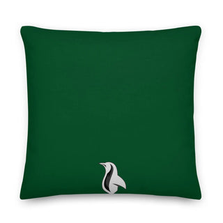 a green pillow with a white bird on it