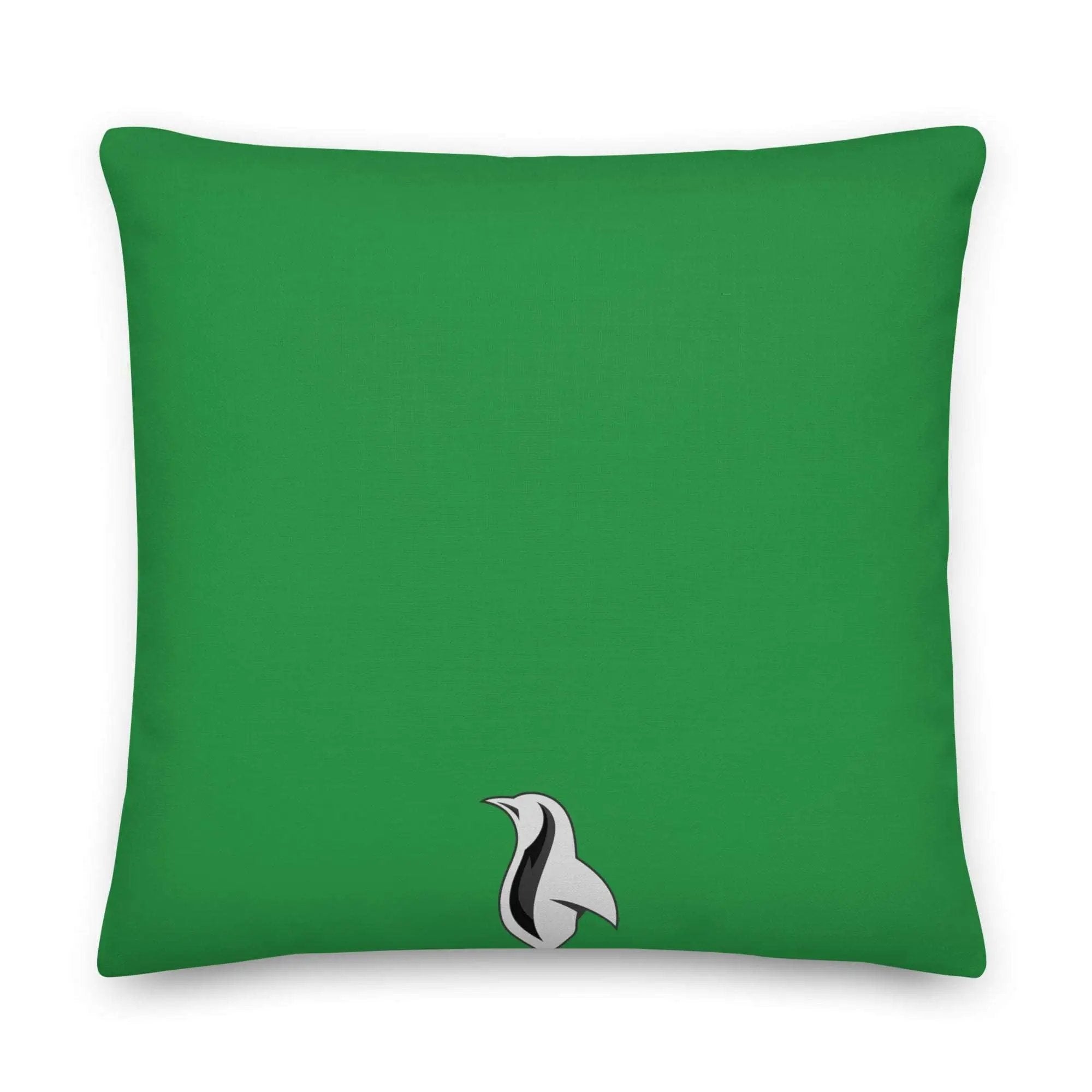 a green pillow with a black and white bird on it