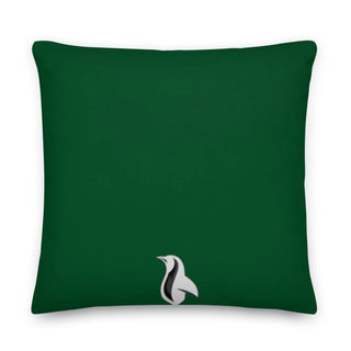 a green pillow with a white bird on it