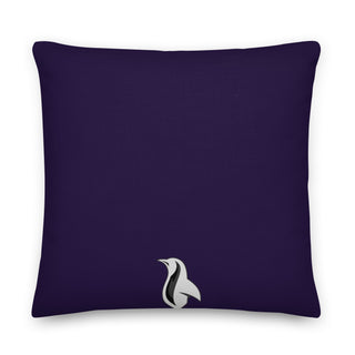 a purple pillow with a white bird on it