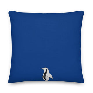 a blue pillow with a black and white bird on it