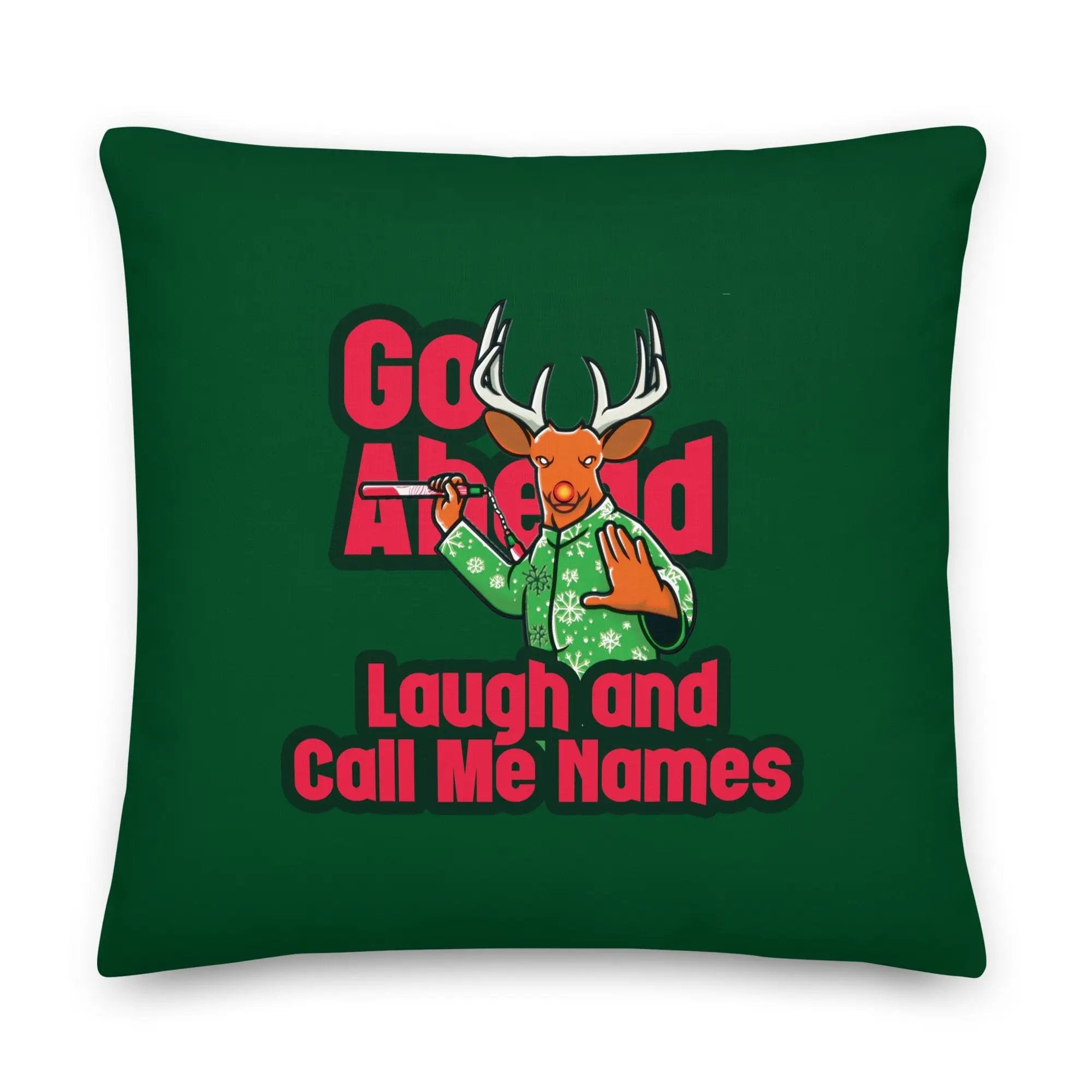 a green pillow with a deer on it