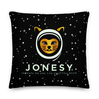 a black pillow with a picture of a cat in a space suit