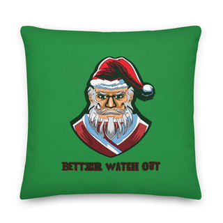 a green pillow with a santa clause on it