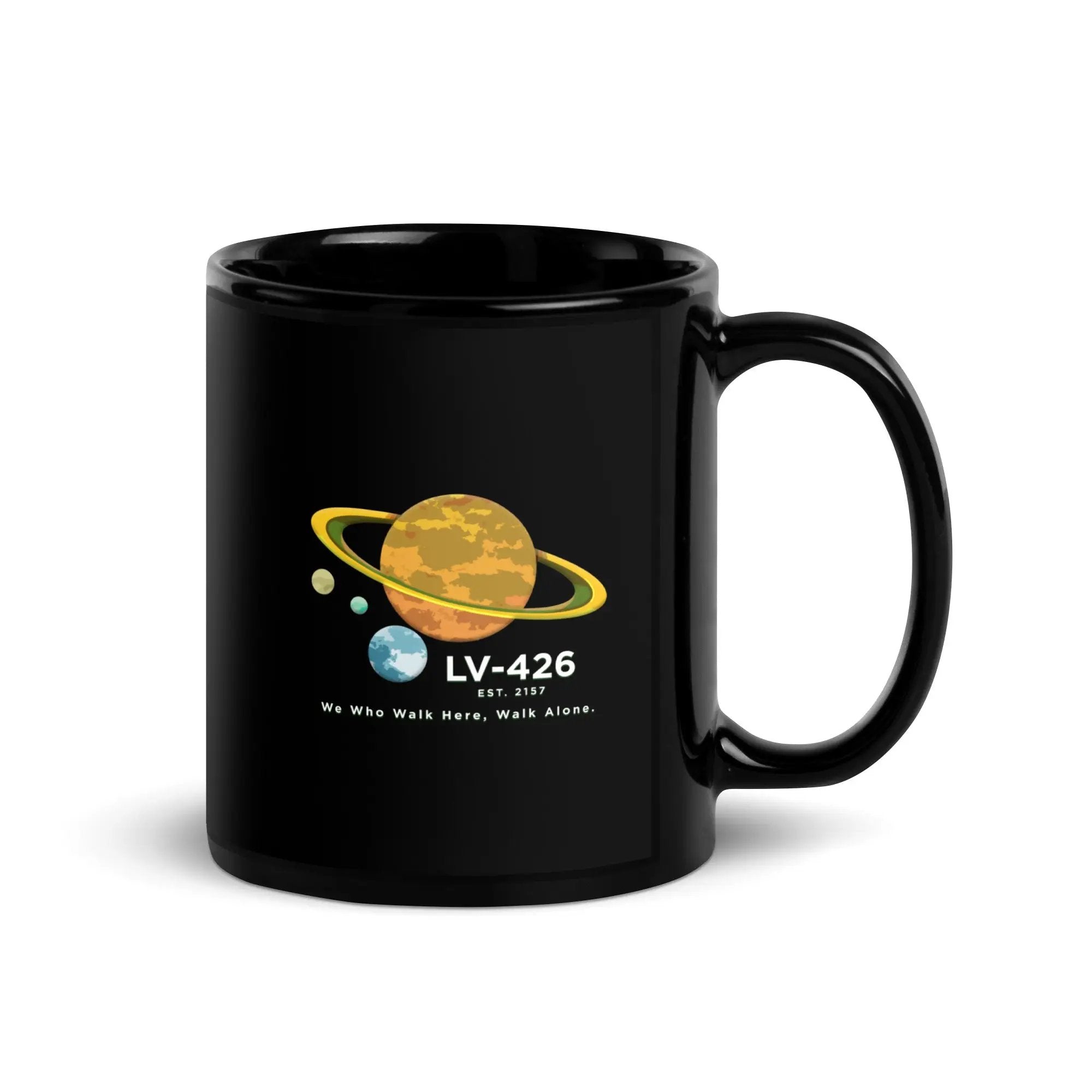 a black mug with a picture of the planets on it