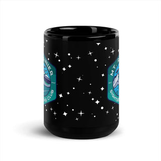 a black coffee mug with stars on it