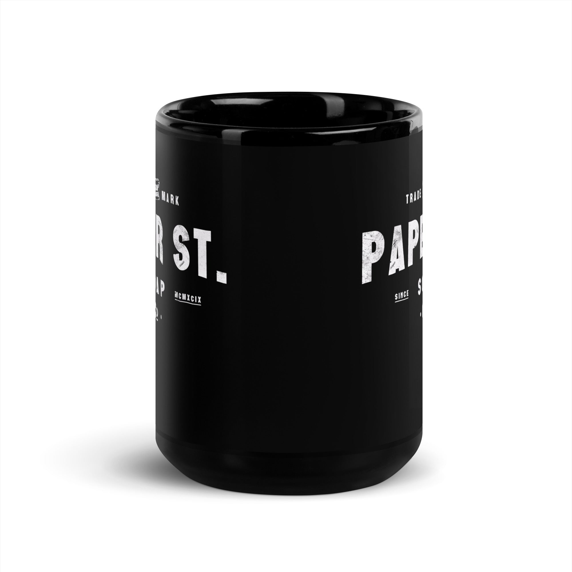 a black coffee mug with the words paper st on it