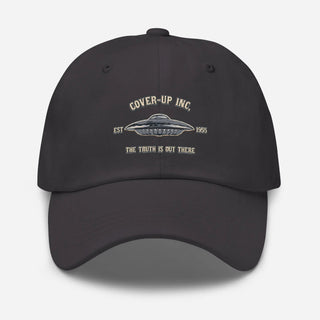a black hat with the words cover up inc on it