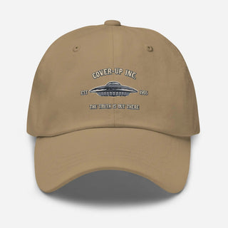 a tan hat with the words cover up inc on it