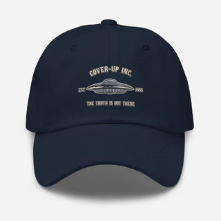 a navy hat with the words cover up inc on it
