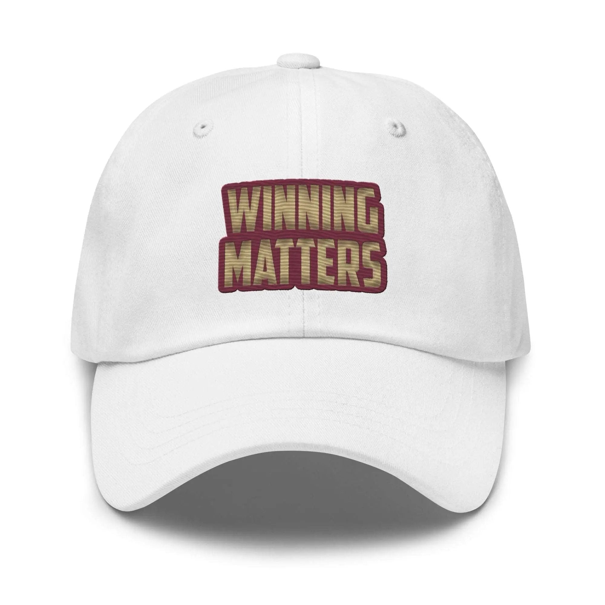 a tan hat with the words winning matters printed on it