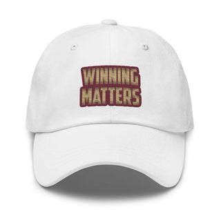 a white hat with the words winning matters printed on it